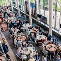 Overhead view of event and people gathered around the various tables